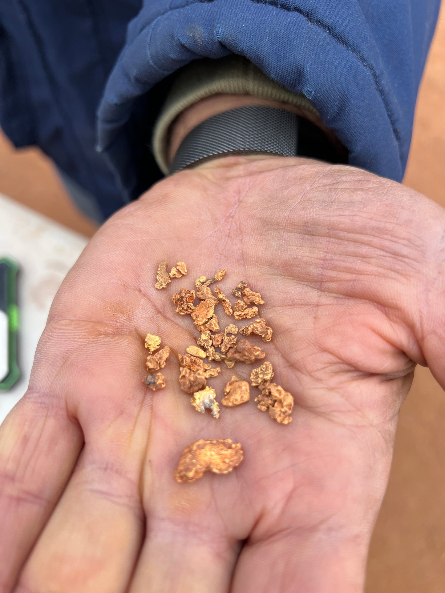 Gold nuggets in hand by customer in Western Australia