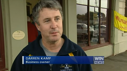 WIN NEWS: Darren Kamp presents a $55k Australia-shaped gold nugget to Julia Gillard