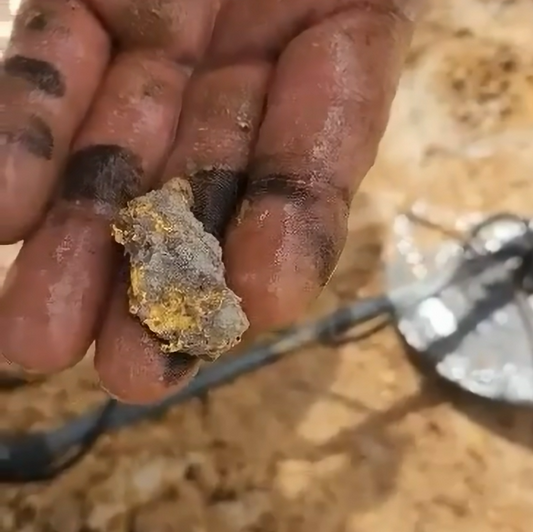 Creekside strike gold prospecting along an Australian creek bed