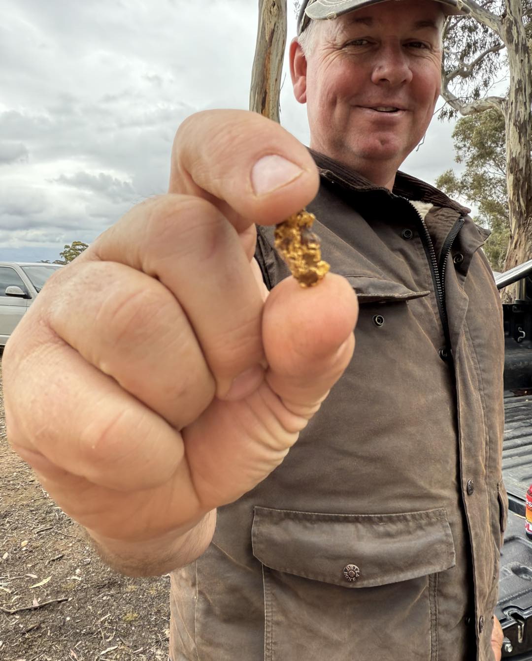 Happy prospector after uncovering gold nugget