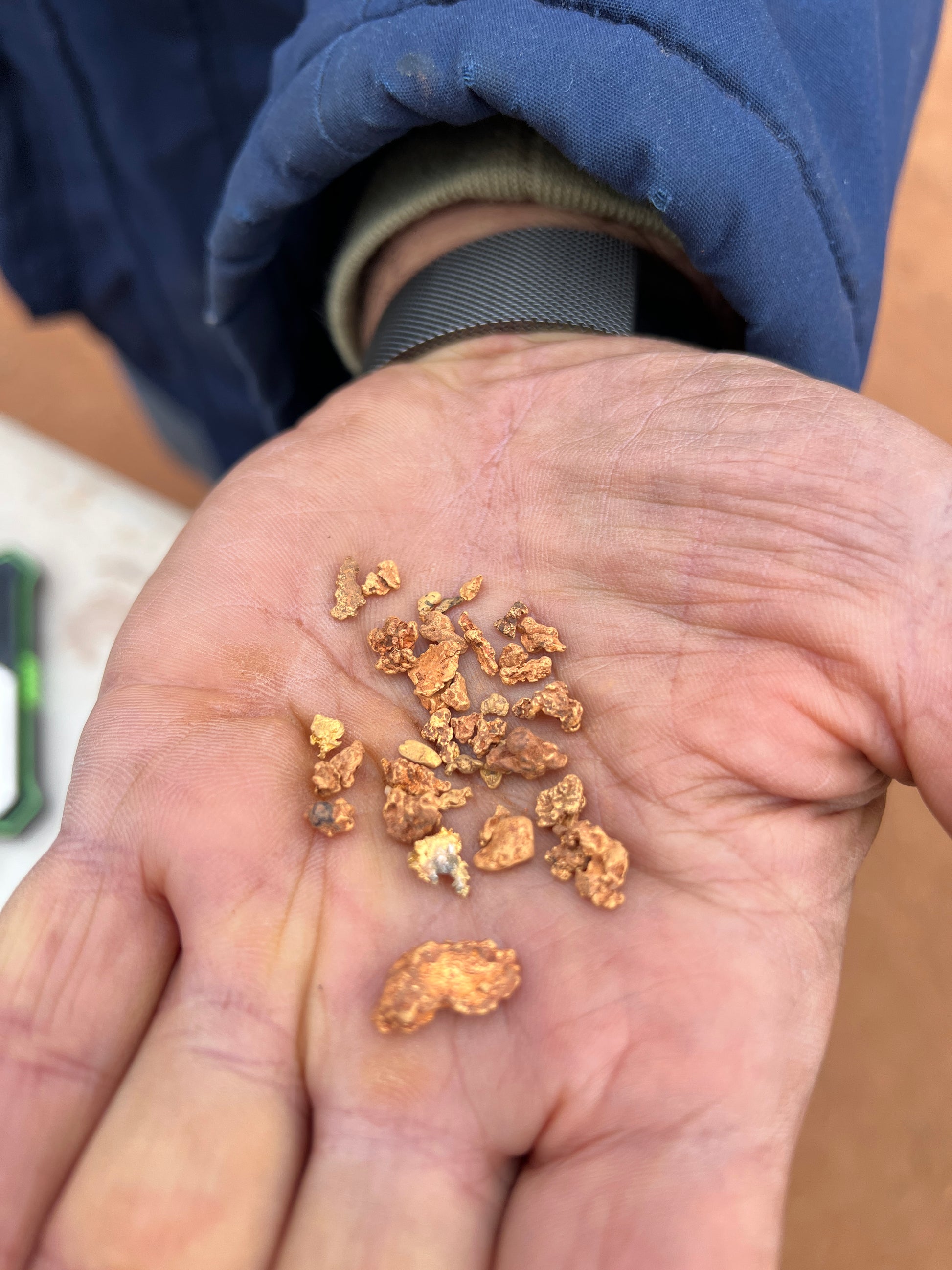 Gold nuggets in hand by customer in Western Australia